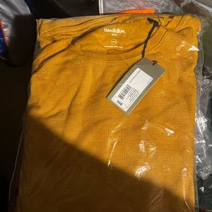 Long sleeved light sweater gold colored brand new with tags in plastic oversized
